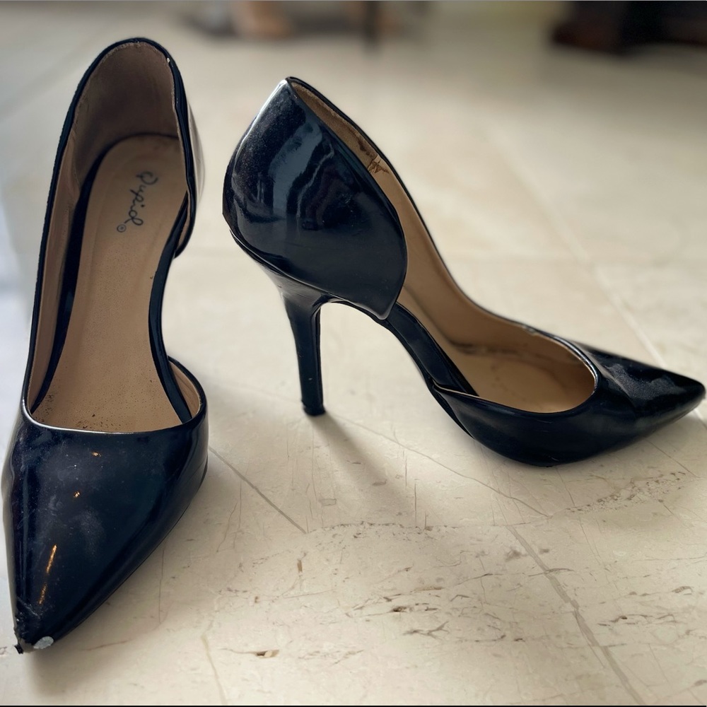 Black Qupid patent pumps